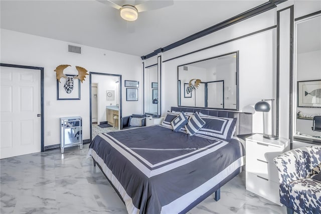 bedroom featuring a barn door, visible vents, a ceiling fan, marble finish floor, and ensuite bath