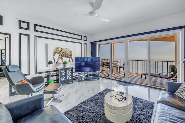 living room with marble finish floor and ceiling fan