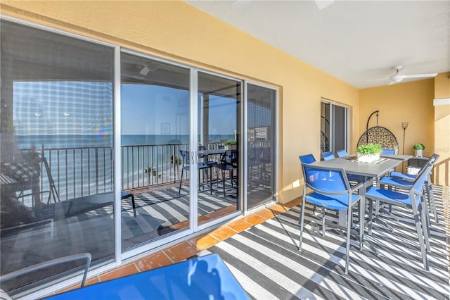 balcony with ceiling fan and outdoor dining area