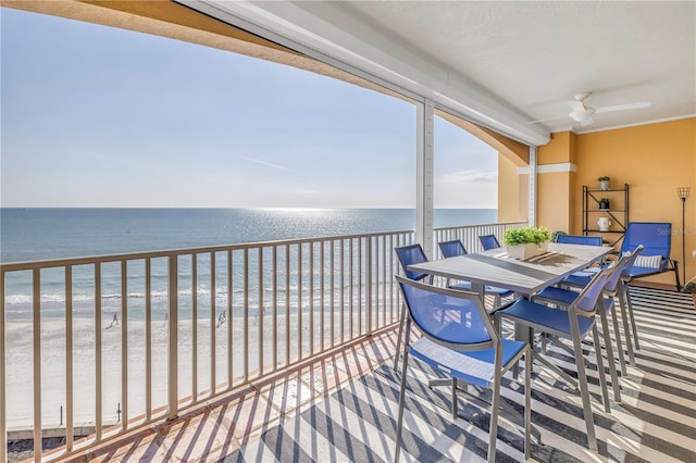 interior space with a water view and a beach view