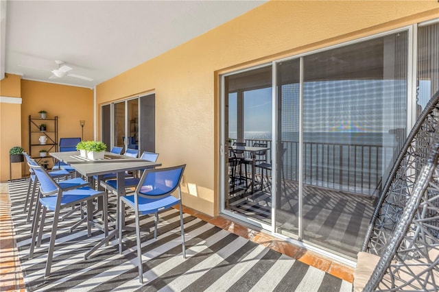 exterior space featuring outdoor dining space and a ceiling fan