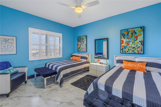 bedroom featuring marble finish floor and ceiling fan