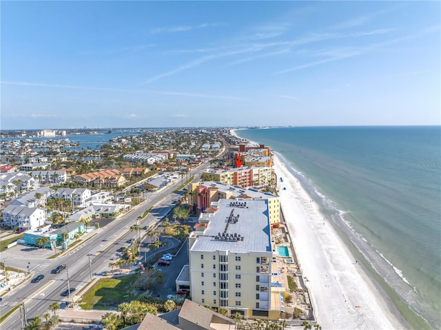 drone / aerial view with a water view and a beach view