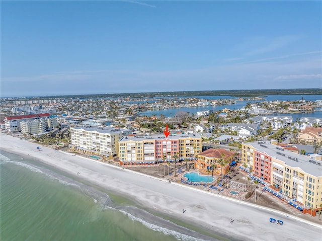 birds eye view of property with a water view, a view of city, and a view of the beach