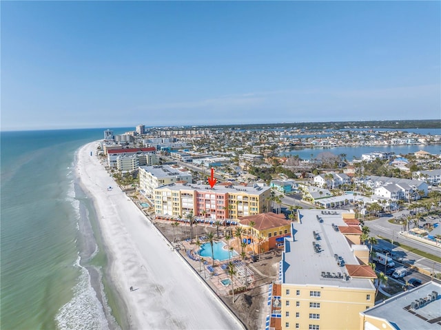 bird's eye view featuring a water view, a city view, and a view of the beach