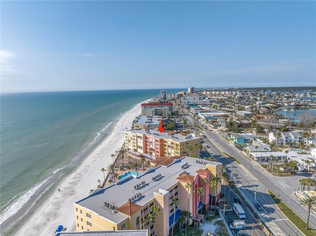 aerial view with a view of the beach, a water view, and a view of city