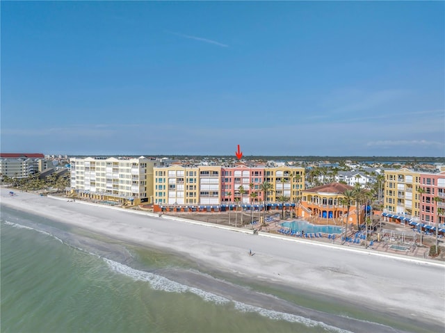 birds eye view of property with a beach view and a water view