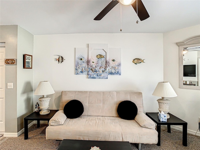 carpeted living room with ceiling fan