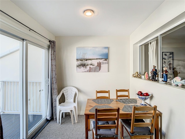 view of carpeted dining area