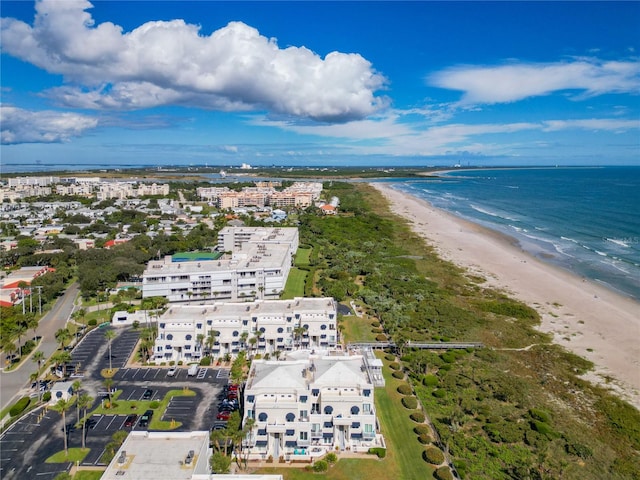 birds eye view of property featuring a view of the beach and a water view