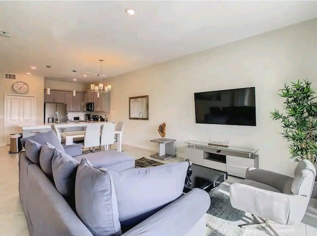 living room featuring a chandelier