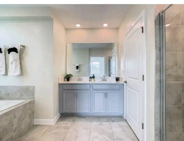 bathroom featuring tile floors, dual bowl vanity, and plus walk in shower