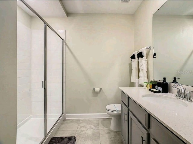 bathroom with walk in shower, toilet, tile floors, and vanity