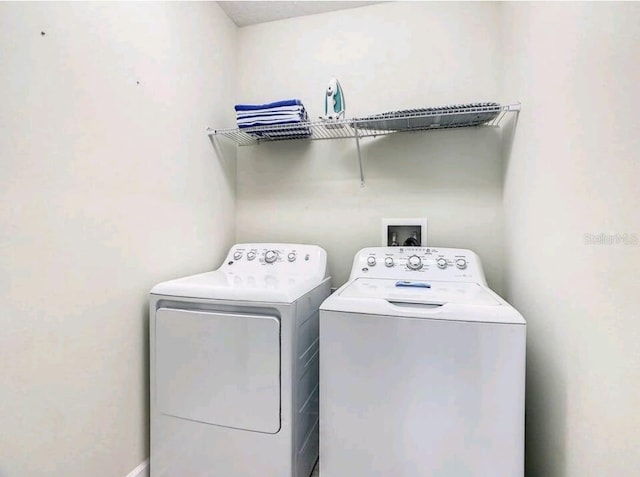 clothes washing area featuring washer hookup and separate washer and dryer