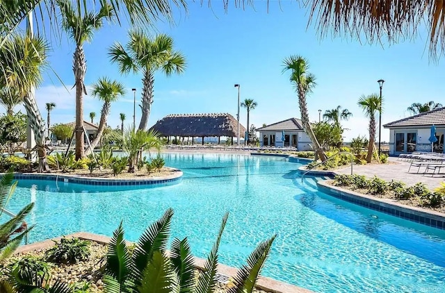 view of swimming pool with a patio