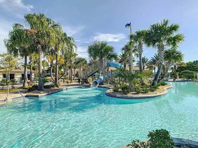 view of pool featuring a water slide