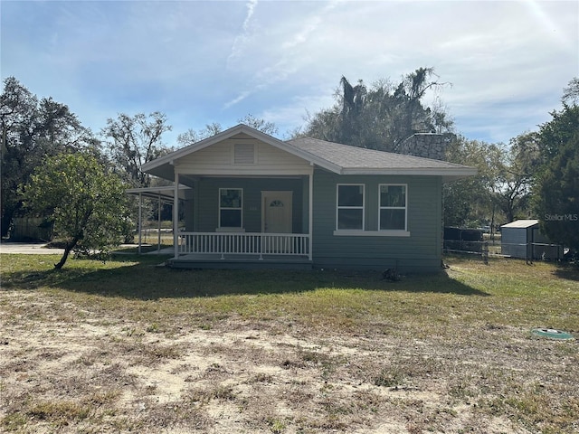 view of front of house with a front lawn and a porch