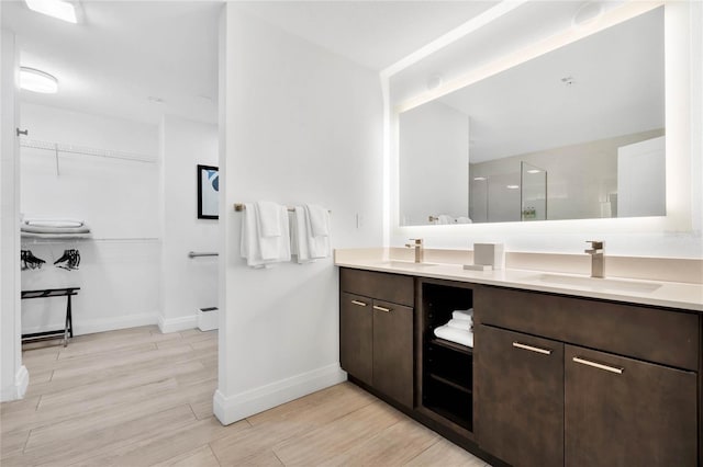 bathroom featuring hardwood / wood-style floors and dual vanity