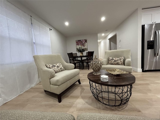 living room with light hardwood / wood-style floors