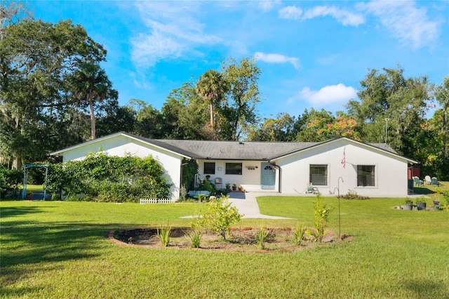 rear view of property with a yard