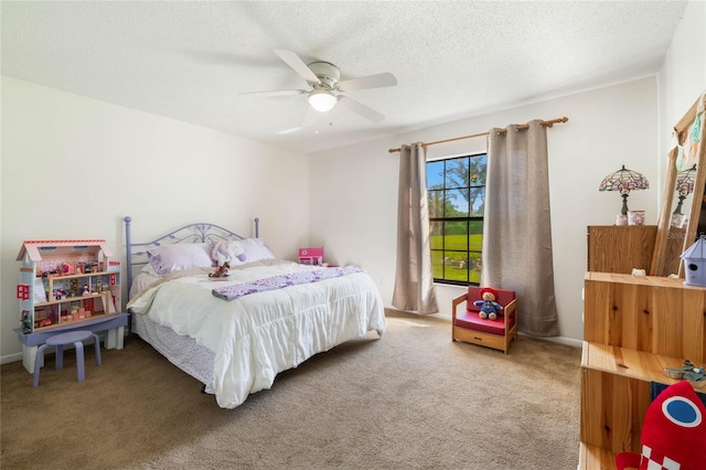 carpeted bedroom featuring a textured ceiling and ceiling fan