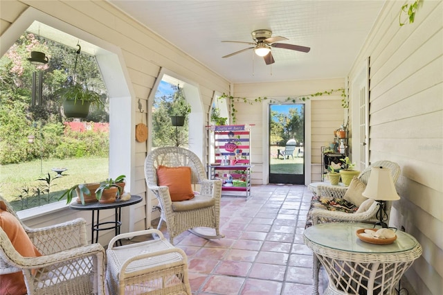 sunroom / solarium with ceiling fan