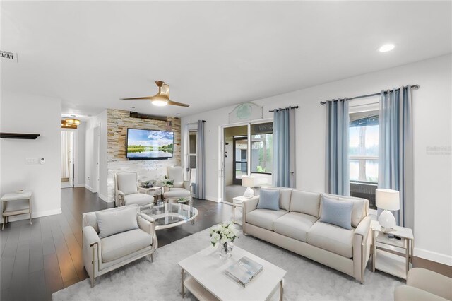 living room with hardwood / wood-style flooring and ceiling fan