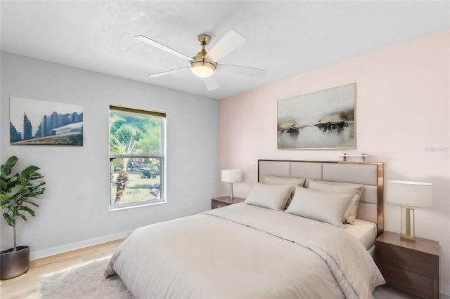 bedroom featuring light hardwood / wood-style flooring and ceiling fan