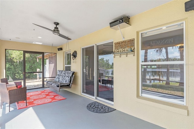 interior space featuring ceiling fan