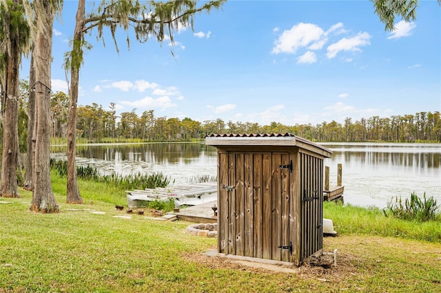 exterior space featuring a water view and a yard