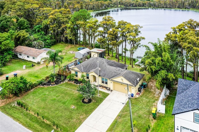 birds eye view of property with a water view