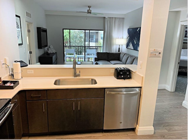 kitchen with ceiling fan, stainless steel appliances, dark brown cabinets, and sink