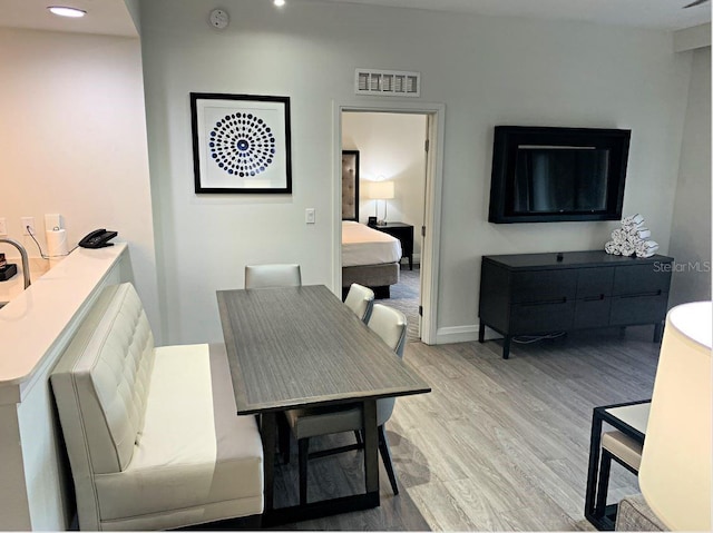 dining room with light hardwood / wood-style flooring