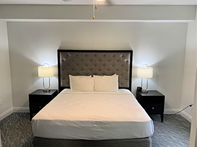 bedroom featuring dark colored carpet