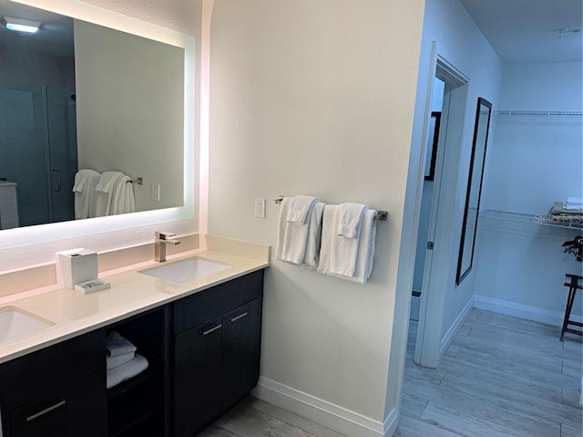 bathroom with vanity and hardwood / wood-style flooring