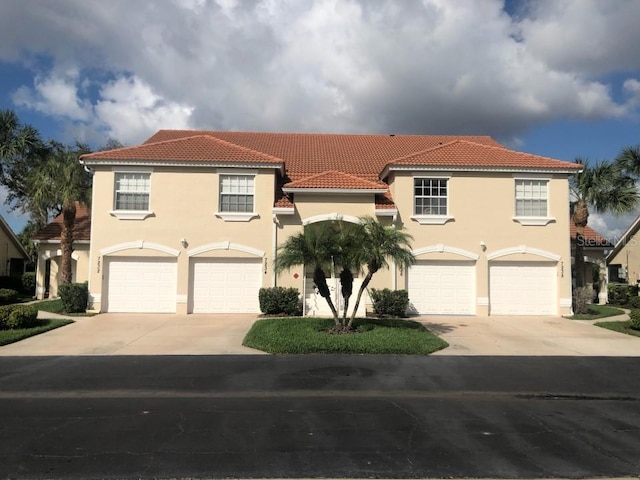 mediterranean / spanish-style house featuring a garage