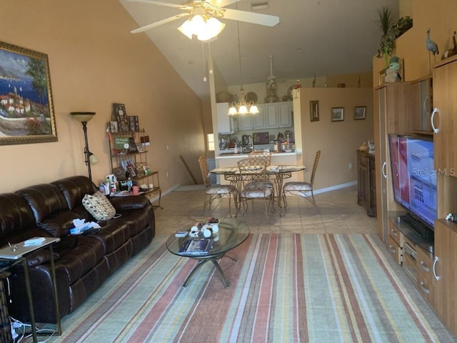 living room with light colored carpet, high vaulted ceiling, and ceiling fan