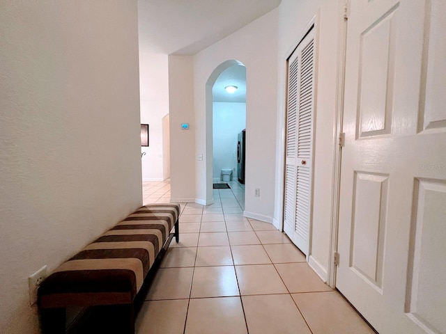 corridor featuring light tile patterned floors