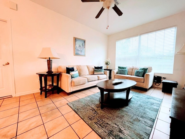 tiled living room featuring vaulted ceiling and ceiling fan