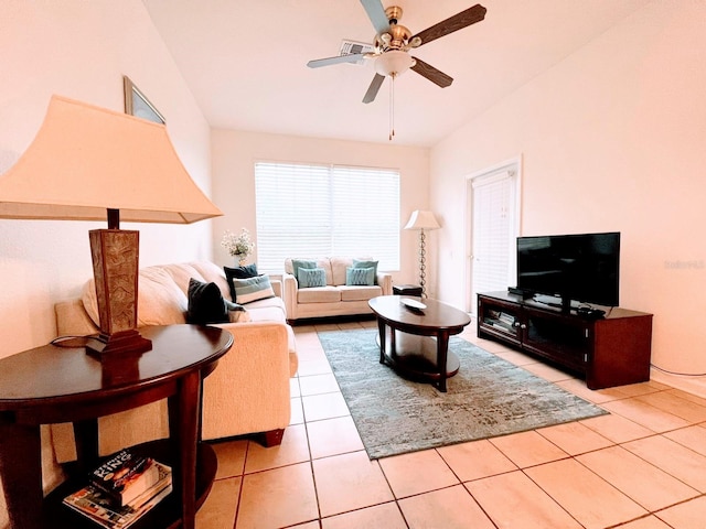 tiled living room featuring ceiling fan