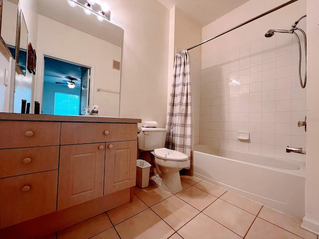 full bathroom featuring toilet, vanity, tile patterned floors, and shower / bath combo with shower curtain