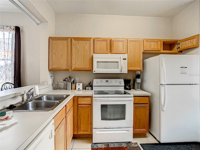 kitchen with white appliances, sink, and light tile floors