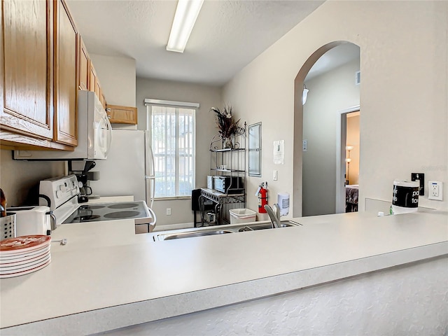 kitchen with white appliances and sink