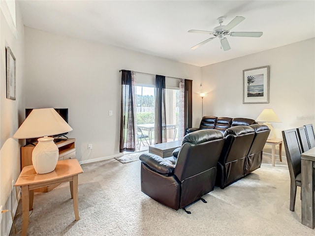 living room featuring light carpet and ceiling fan