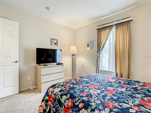 bedroom with light colored carpet