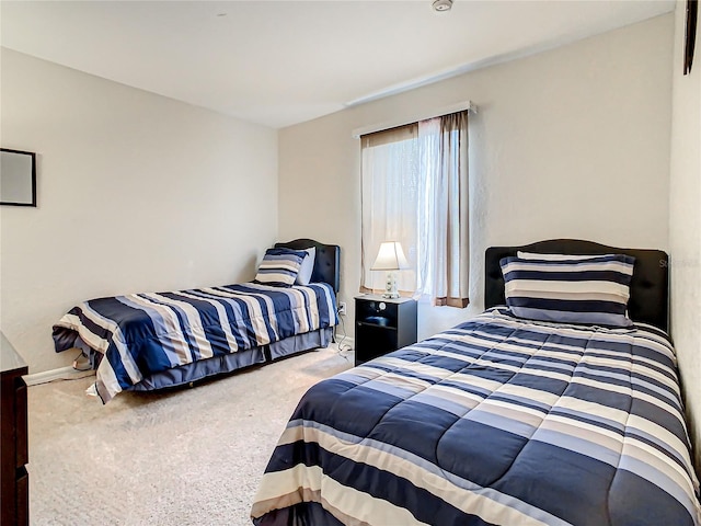 bedroom with light colored carpet