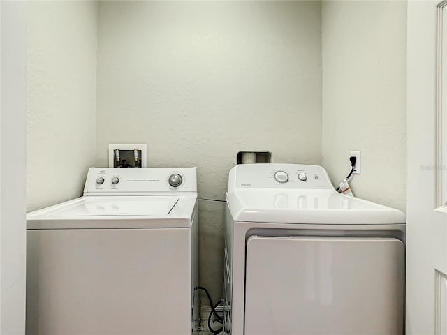 laundry area featuring hookup for a washing machine and separate washer and dryer