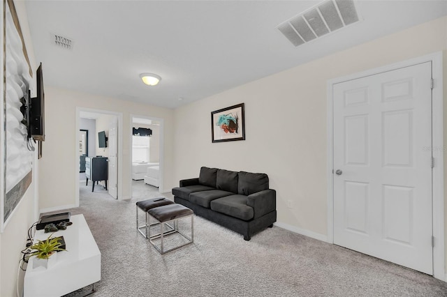 living room featuring light colored carpet