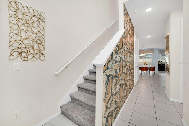 staircase featuring tile patterned flooring