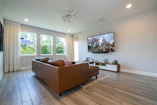 living room with light hardwood / wood-style flooring